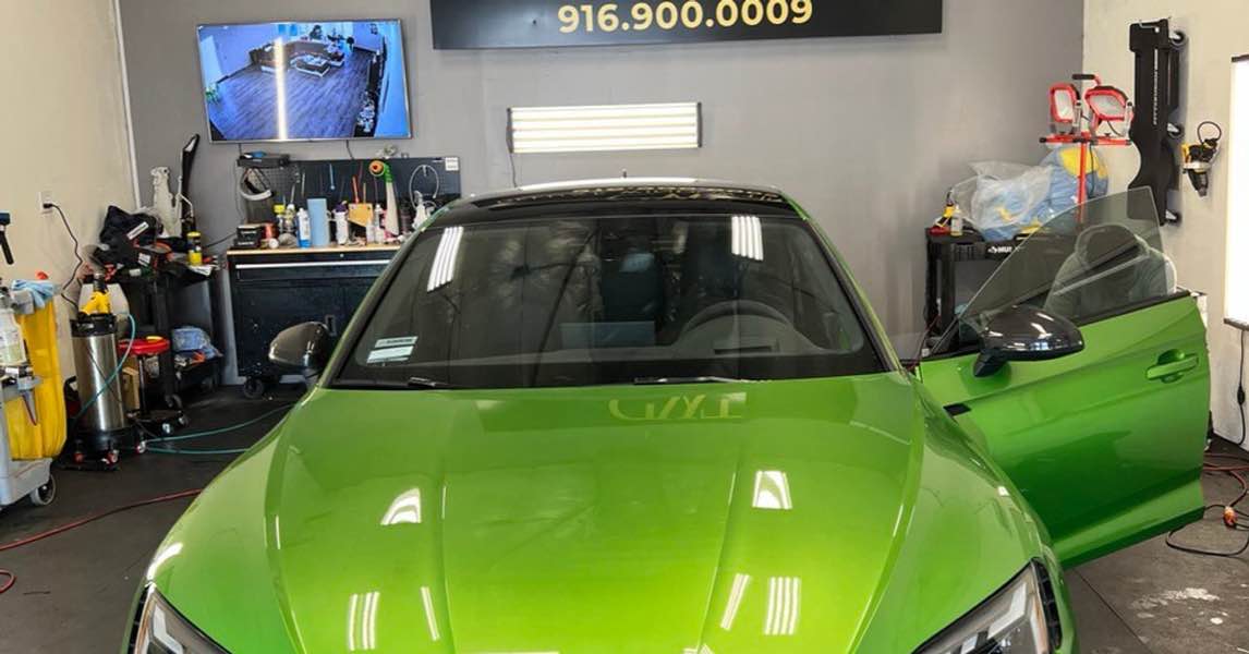 Green Audi RS5 in a professional window tinting shop in Gold River, CA.
